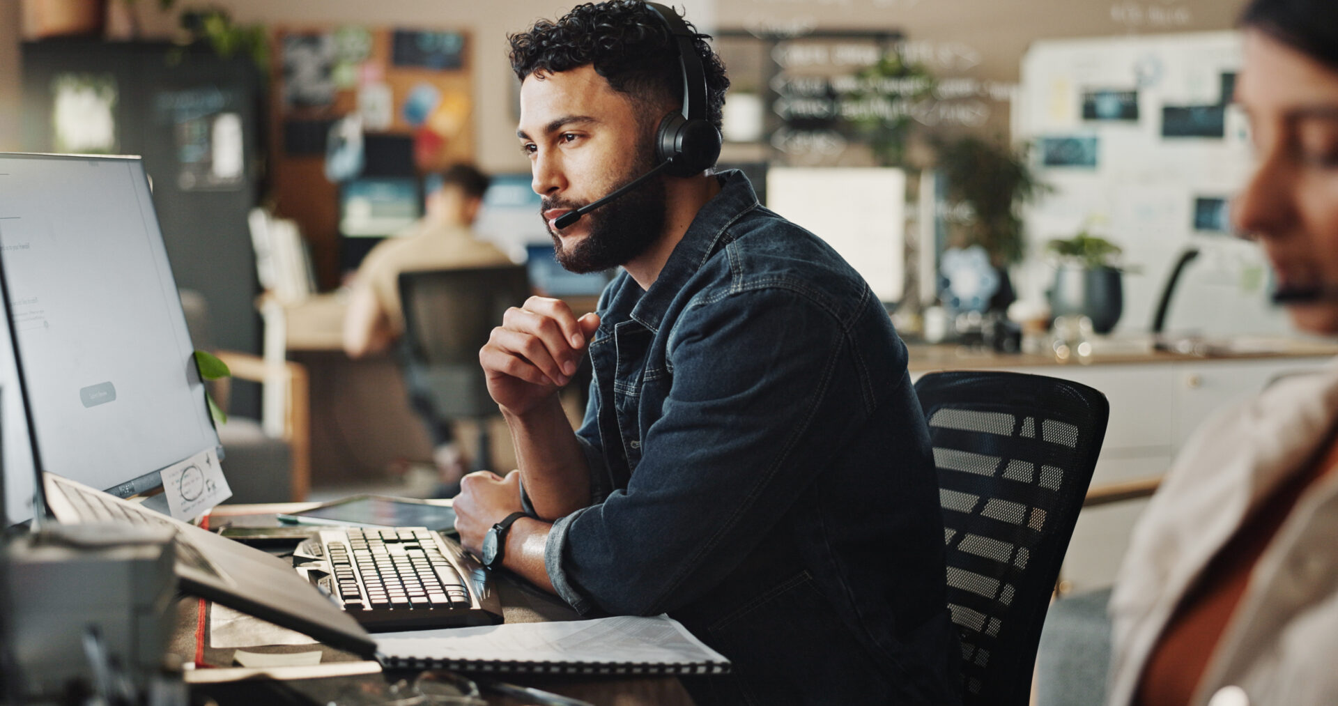 Headset, tech support and man in call center with computer, online advice and website management. Virtual assistant, customer service or IT consultant in coworking space with help, discussion and crm